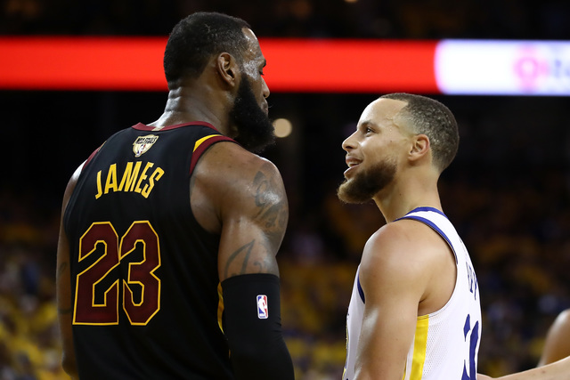 Warriors beat Cavs 124-114 in OT to open NBA Finals