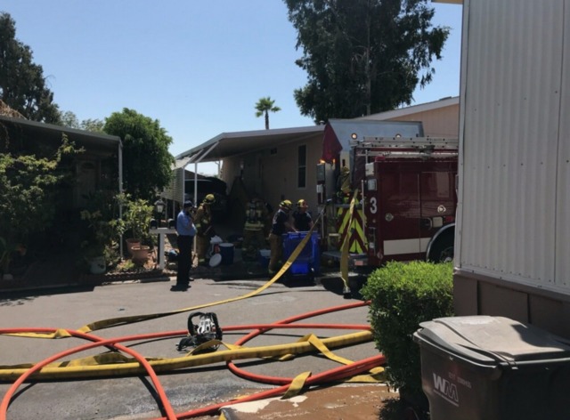 Neighbors save woman and dog from fire