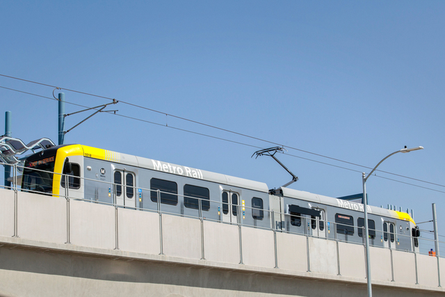 Man in suit drags unconscious man off Long Beach Metro train