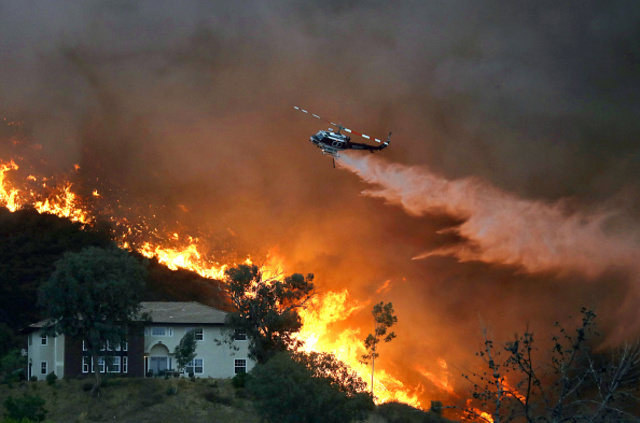 Over 20,000 forced to flee as Holy Fire grows